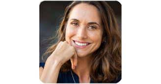 Maria, a 45-year-old fitness enthusiast, looking happy and satisfied after using FemiPro for urinary health and microbiome balance